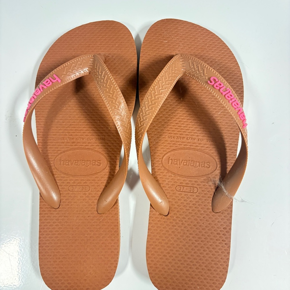 Havaianas Women’s Tan Flip Flops with Pink Logo